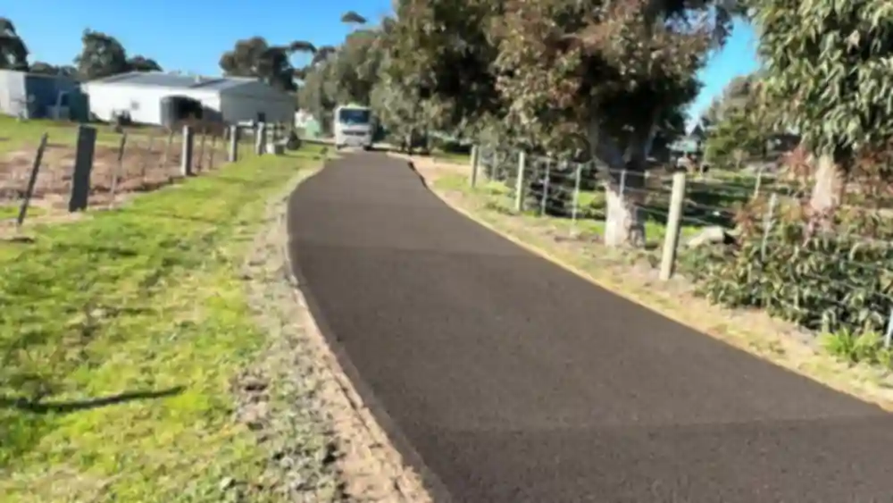 Long residential asphalt driveway constructed by Strata Surfacing in Perth